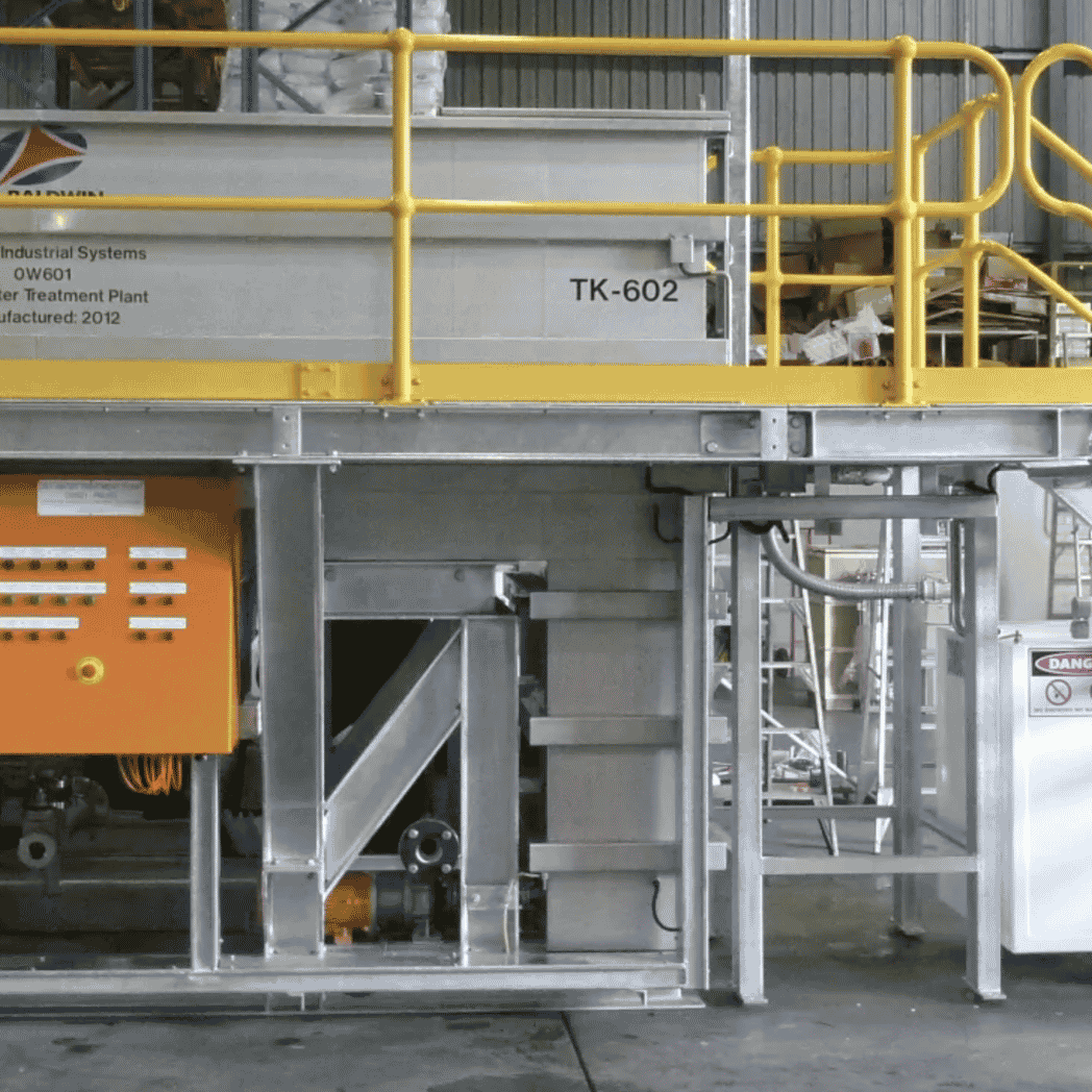 A coalescing oil separator treatment plant with various tanks, filters, and pipes which combine as an oil water separator system.